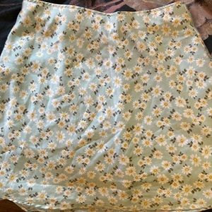 This skirt is super soft and silky, and is detailed with flowers.